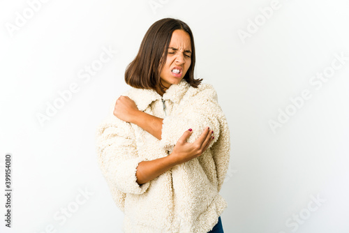 Young mixed race woman massaging elbow, suffering after a bad movement.