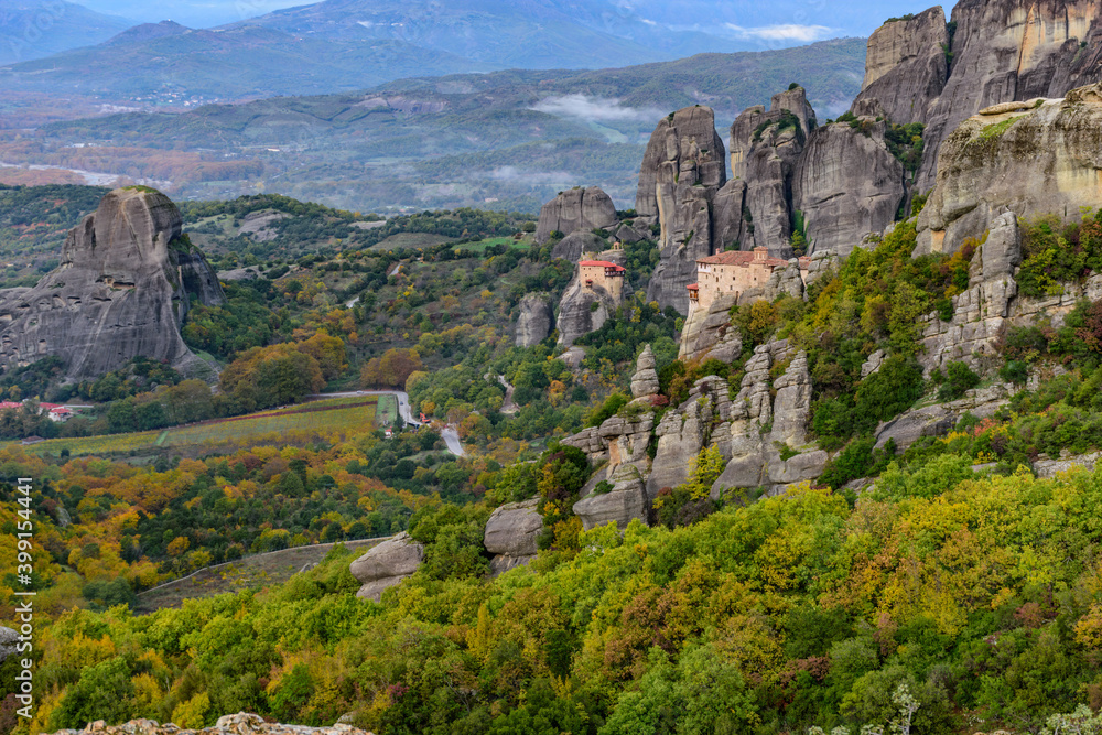 Roussanou and Αgios Nikolaos monastery, an unesco world heritage site,  located on a unique rock formation  above the village of Kalambaka during fall season.