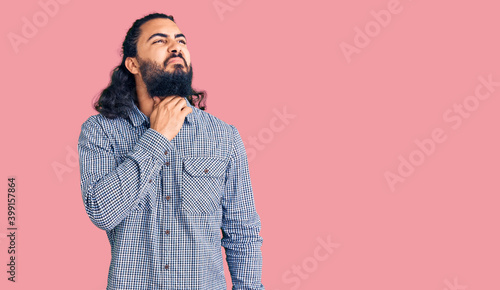 Young arab man wearing casual clothes touching painful neck, sore throat for flu, clod and infection