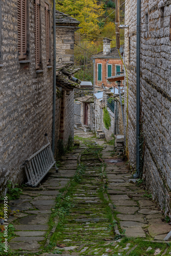 The picturesque village of Dilofo during fall season with its architectural traditional old stone  buildings located on Tymfi mount, Zagori, Epirus, Greece, Europe
