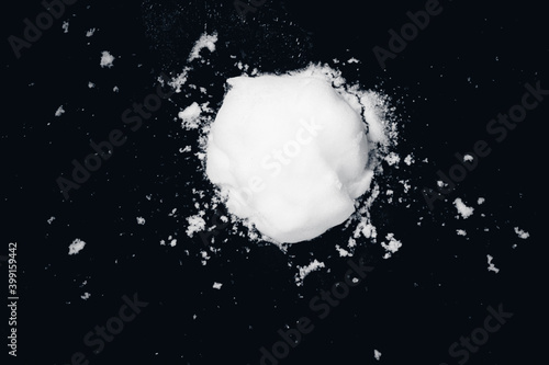 Fototapeta snowball splat on black wall