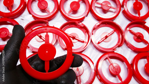 Red round cosmetic plastic ,  From the manufacturing department in a plastic factory. photo