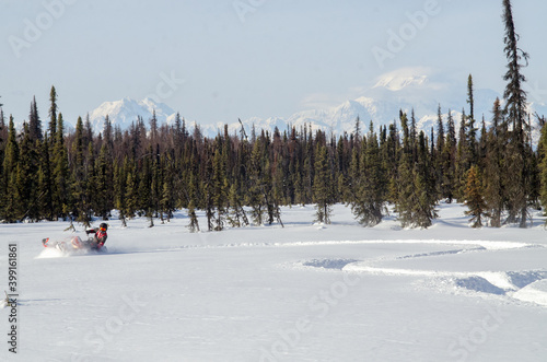 Backcountry snowmachine rider "sledder" in Alaska.