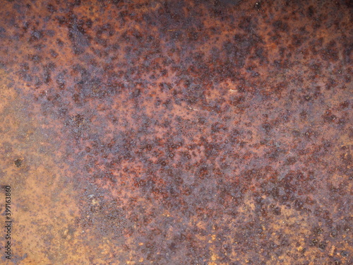 Oxidized metal surface, Closeup to rust on iron surface, Abstract rusty metal panel texture background, Selective focus.