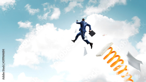 Wallpaper Mural Businessman jumping on springboard . Mixed media Torontodigital.ca