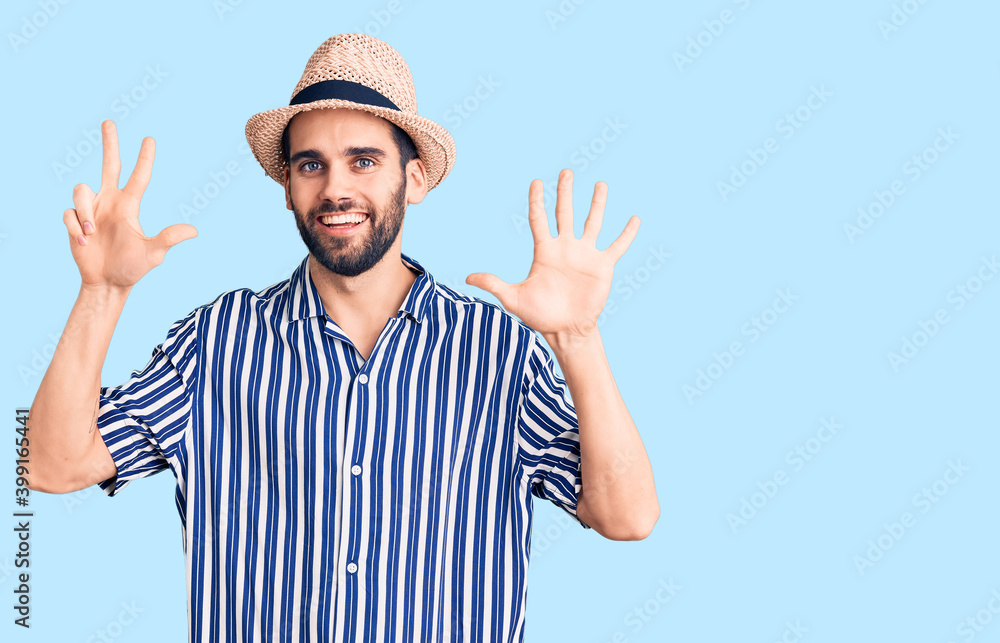 Young handsome man with beard wearing summer hat and striped shirt showing and pointing up with fingers number eight while smiling confident and happy. Young handsome man with beard wearing summer hat and striped shirt showing and pointing up with fingers number eight while smiling confident and happy.