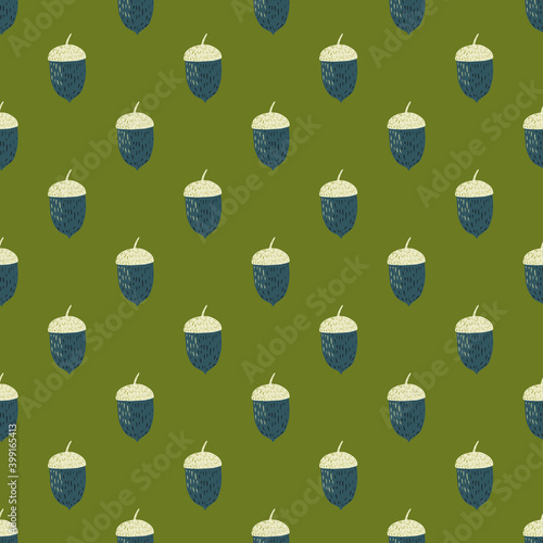 Navy blue and white colored acorn ornament seamless pattern. Green background. Autumn print.