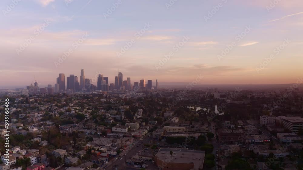 Aerial panning shot of Downtown Los Angeles skyline with sun setting. 4K Aerial panning shot of Downtown Los Angeles skyline with sun setting. 4K