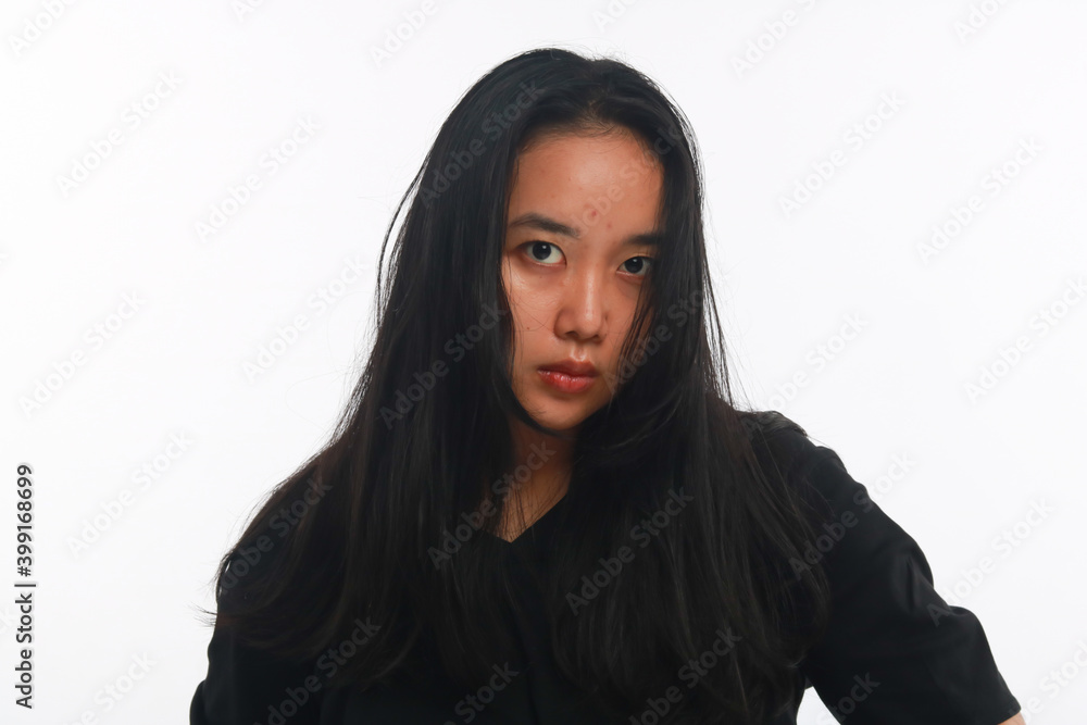 Young Asian woman with no make up on white background. Young Asian woman with no make up on white background.