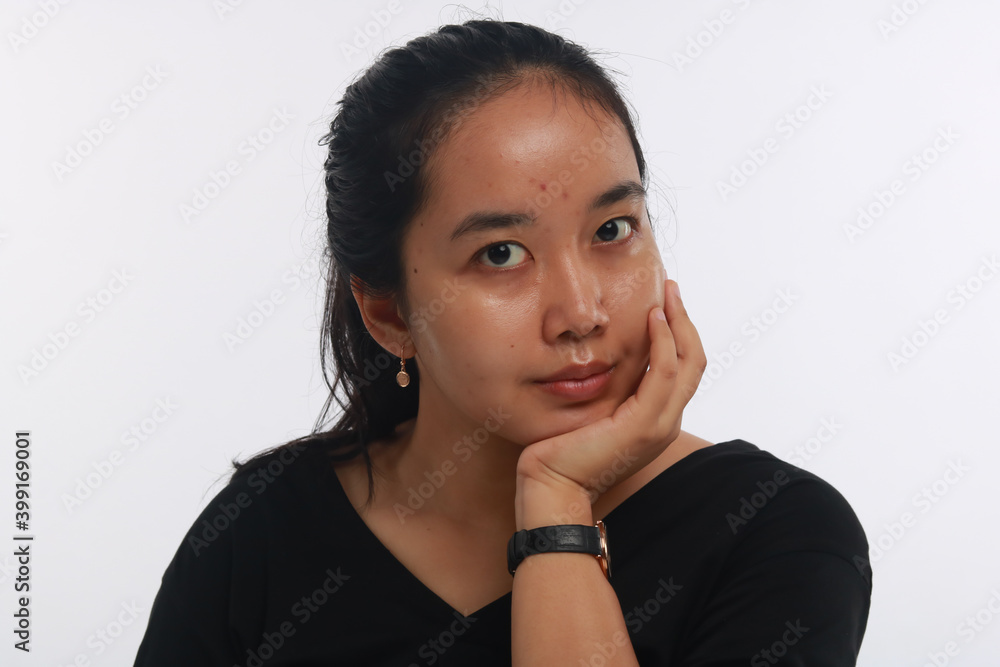 Young Asian woman with no make up on white background. Young Asian woman with no make up on white background.