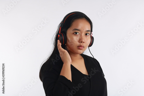Full length view of trendy asian girl on white background.