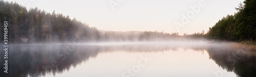 Foggy lake at sunrise in autumn season © Pawel Pajor