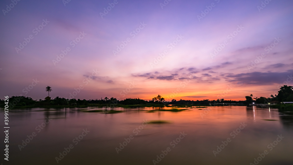 twilight landscape the riverside and tree silhouette long exposures shot in Thailand twilight landscape the riverside and tree silhouette long exposures shot in Thailand