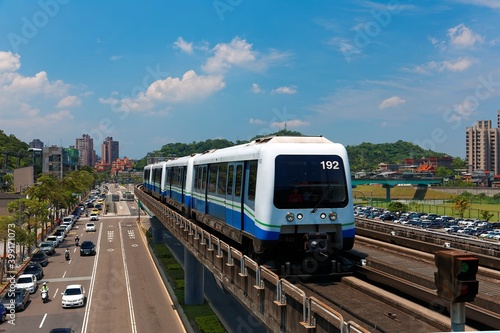 Canvas Print View of a train traveling on elevated rails of Taipei Metro System in suburban a