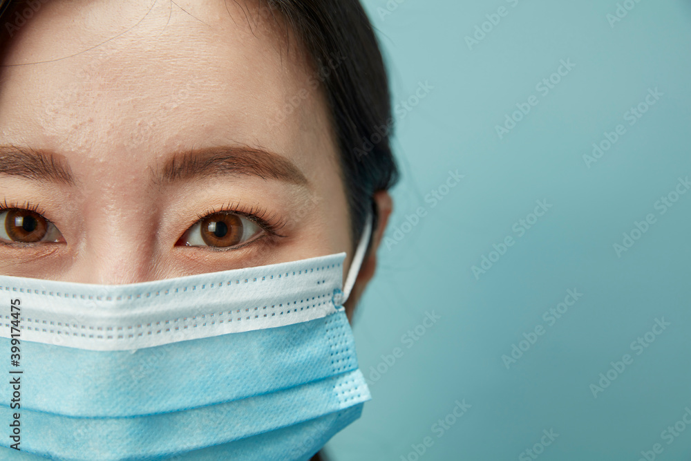 Asian woman with mask closed-up Asian woman with mask closed-up