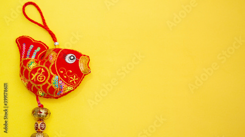 Translation of text appear in image: fortune good luck. Lucky Red Fish - Lunar New Year Decoration , Vietnamese Tet Holiday top view isolated on yellow background