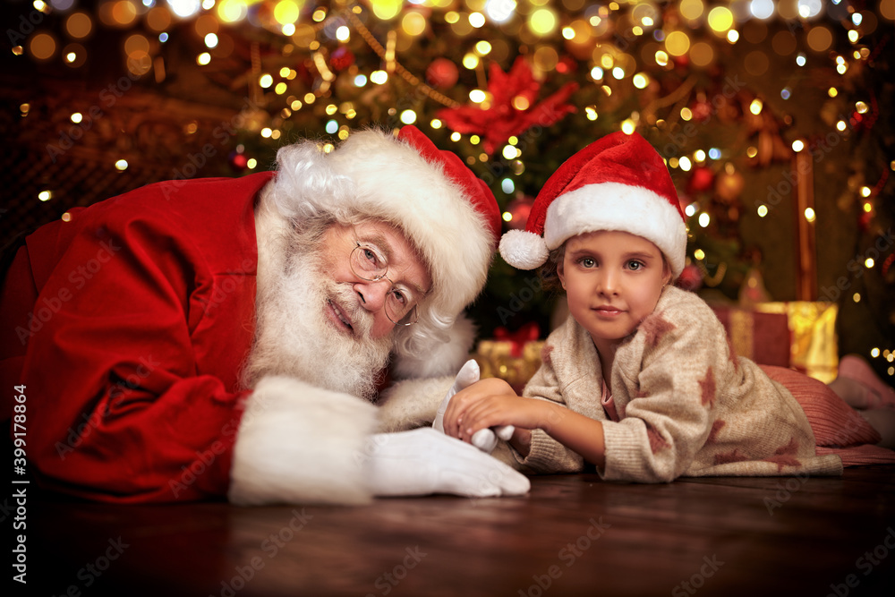 Obraz premium jolly Santa with a child