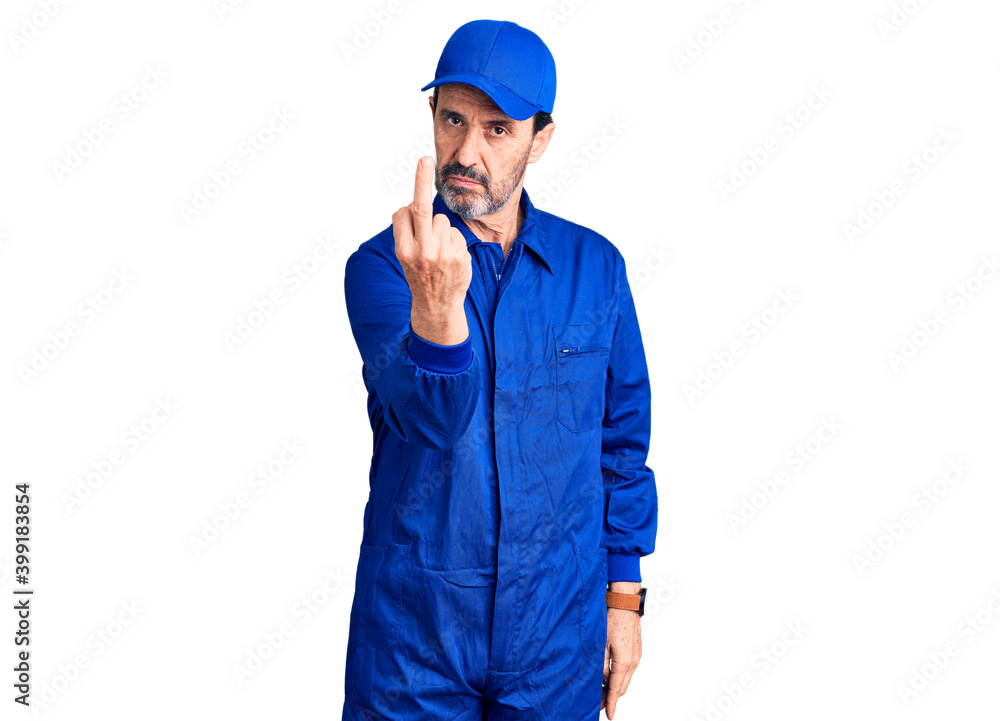 Middle age handsome man wearing mechanic uniform showing middle finger, impolite and rude fuck off expression Middle age handsome man wearing mechanic uniform showing middle finger, impolite and rude fuck off expression