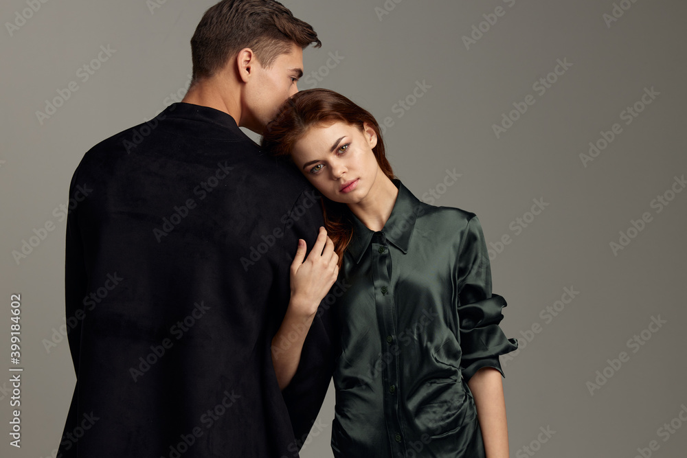 Back view of a romantic woman leaning on the shoulder of a man in a suit Back view of a romantic woman leaning on the shoulder of a man in a suit