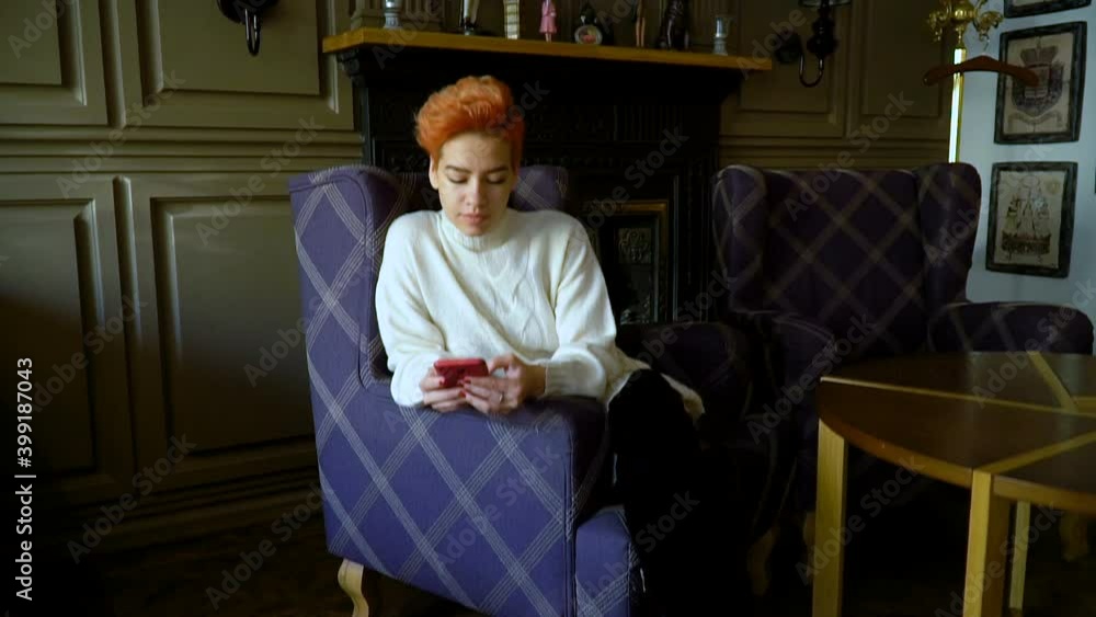 Girl with a phone in a cafe Girl with a phone in a cafe