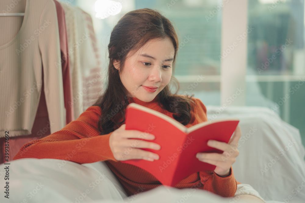 Beauty asian woman black hair reading red book at home. Beauty asian woman black hair reading red book at home.