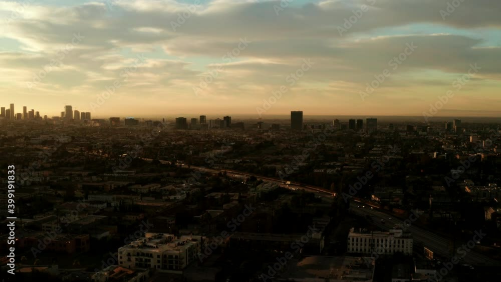Cars traveling towards the Los Angeles City Skyline Drone shot. Cars traveling towards the Los Angeles City Skyline Drone shot.