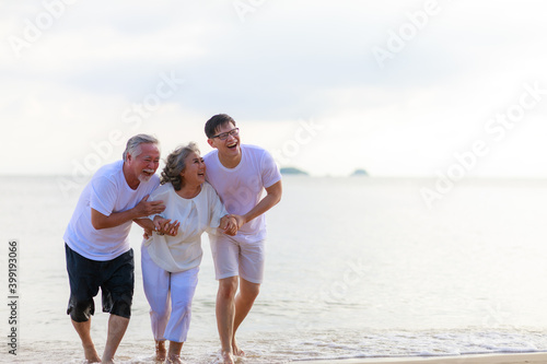 Happy family walking relax on the beach.