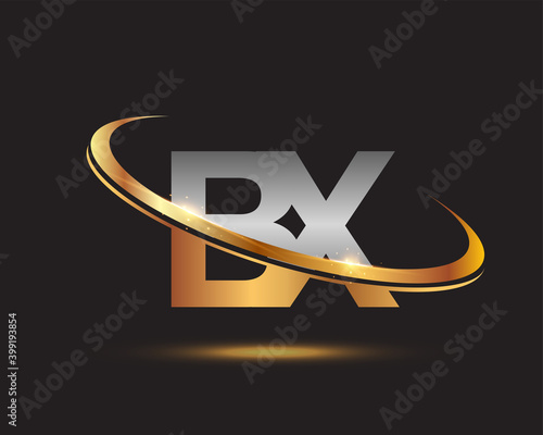 initial letter BX logotype company name colored gold and silver swoosh design. isolated on black background. photo