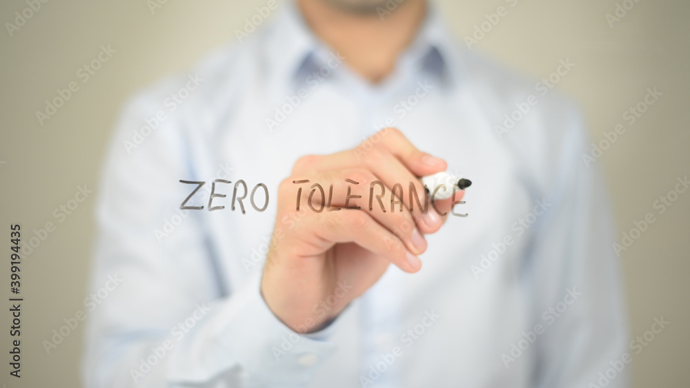 Zero Tolerance , man writing on transparent screen Zero Tolerance , man writing on transparent screen