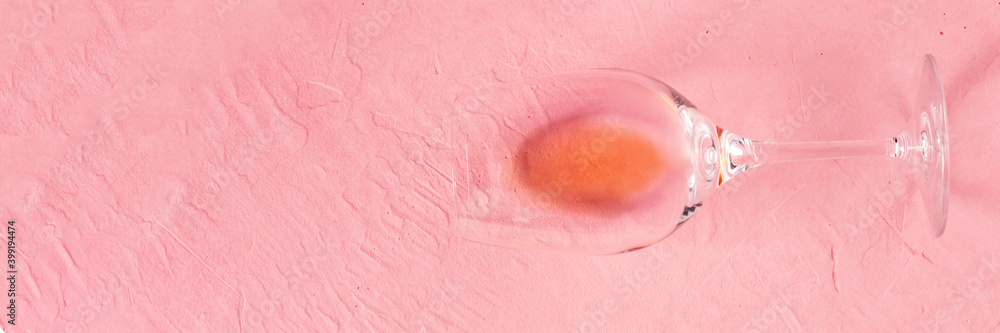 Fototapeta premium Rose wine panorama, shot from above on a pink background with a place for text or logo
