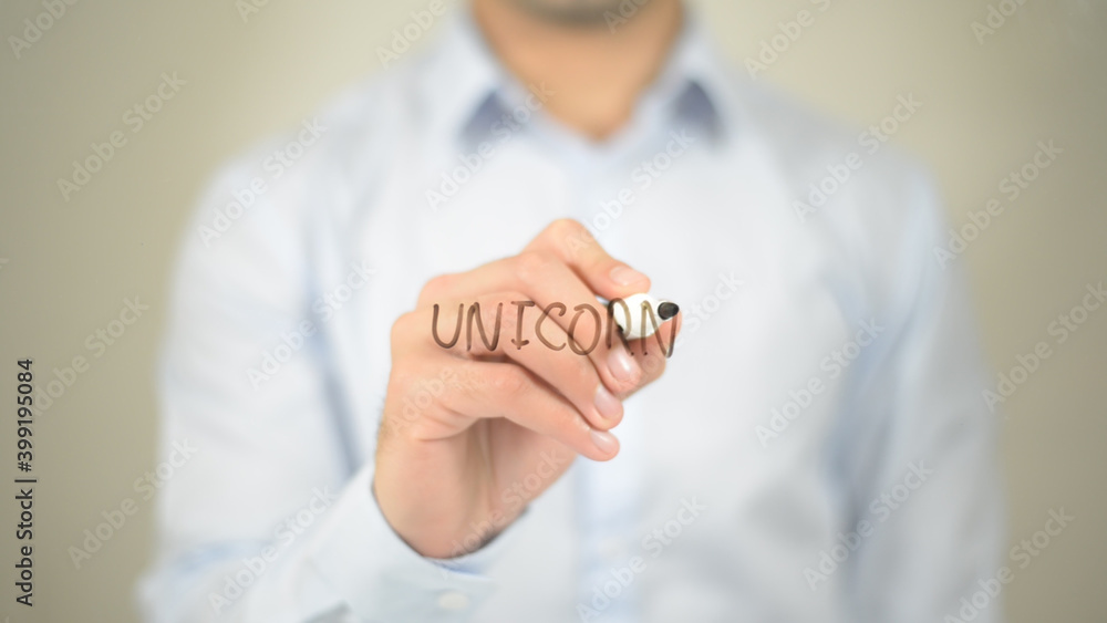 Unicorn , man writing on transparent screen Unicorn , man writing on transparent screen