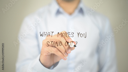 What Makes You Stand out, man writing on transparent screen