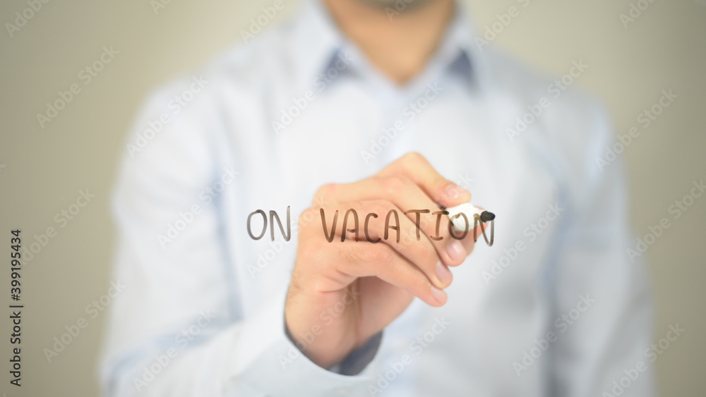 On Vacation , man writing on transparent screen On Vacation , man writing on transparent screen