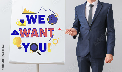 Businessman near flipchart ...
