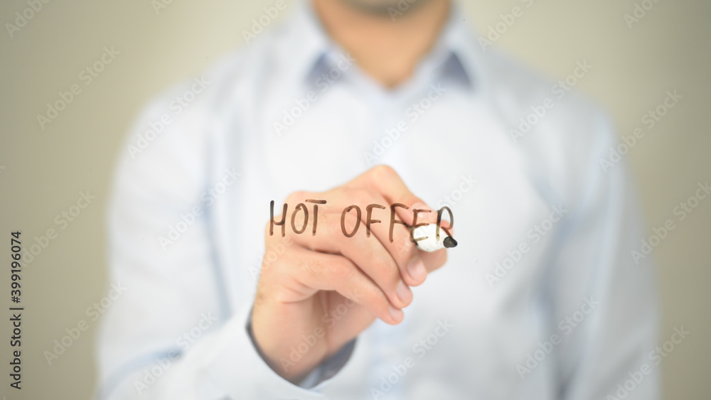 Hot Offer, man writing on transparent screen Hot Offer, man writing on transparent screen