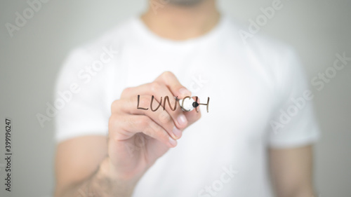 Lunch, man writing on transparent screen