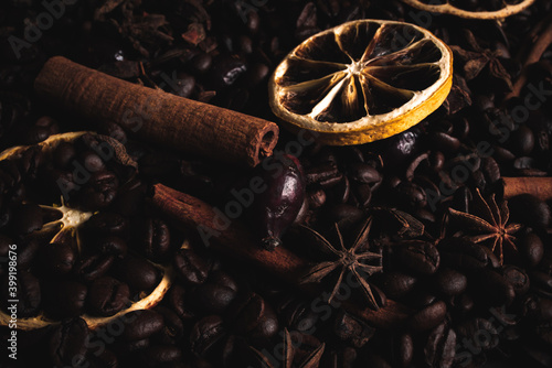 Coffe background with dried oranges and cinnamon