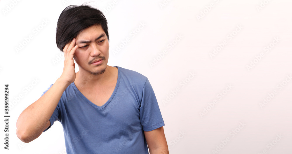 Fototapeta premium Portrait of a handsome,Asian man with a headache on White background in studio With copy space.