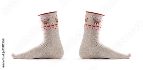Christmas socks on the foot. Close up. Isolated on a white background