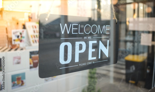 "Welcome we are open" ้hang tag at cafe or restaurant hang on entrance door.