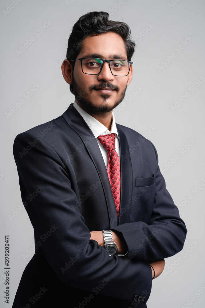 Successful Young indian business man posing over white background Successful Young indian business man posing over white background