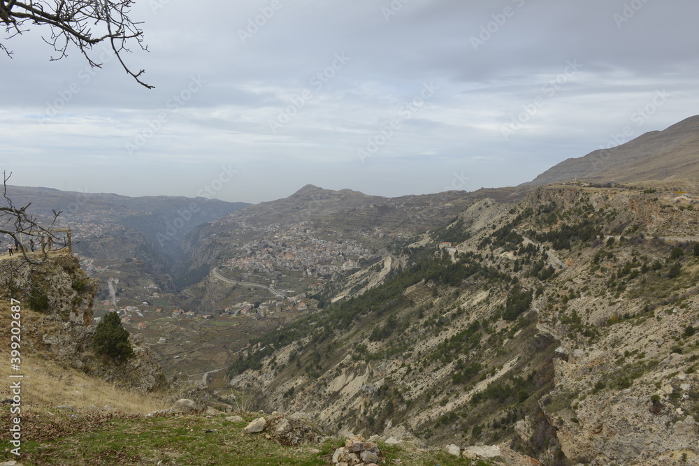 Fototapeta premium Aerial shot of the valley and village. Lebanese village. Calm before the storm. Fall season