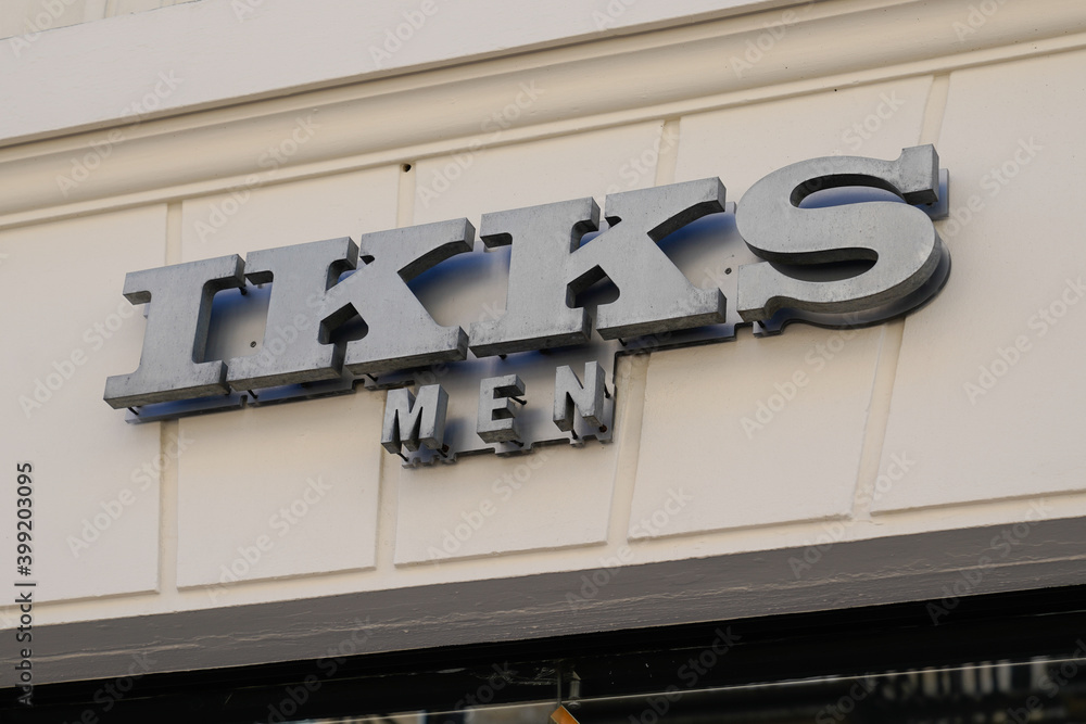 ikks men logo and sign text front of store fashion brand clothes shop ...