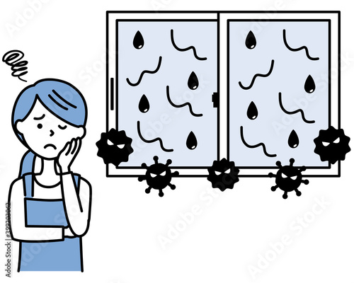 窓の結露とカビに悩むエプロンの女性　A woman suffering from condensation and mold on windows