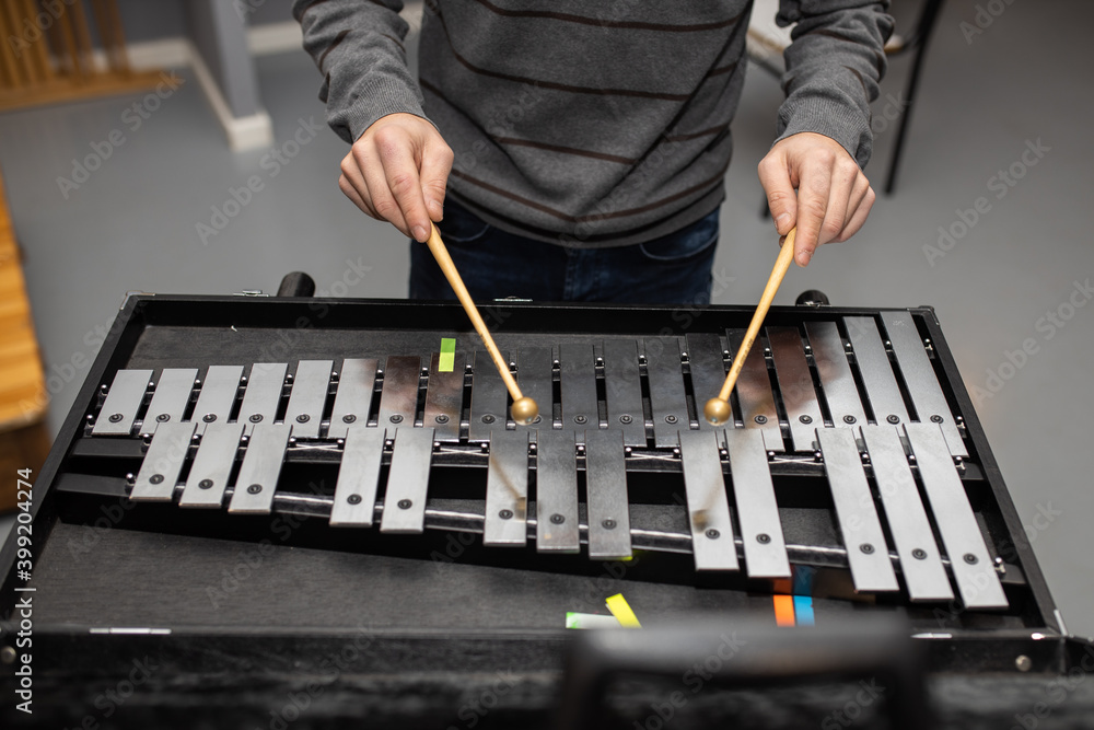 man playing metal xylophone percussion musical instrument
