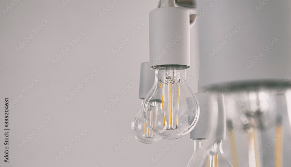 Many retro led lamps hanging on the wooden plank Many retro led lamps hanging on the wooden plank