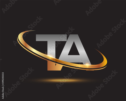 initial letter TA logotype company name colored gold and silver swoosh design. isolated on black background. photo