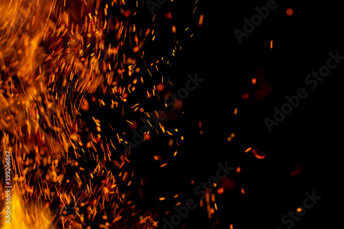 flame of fire with sparks on a black background