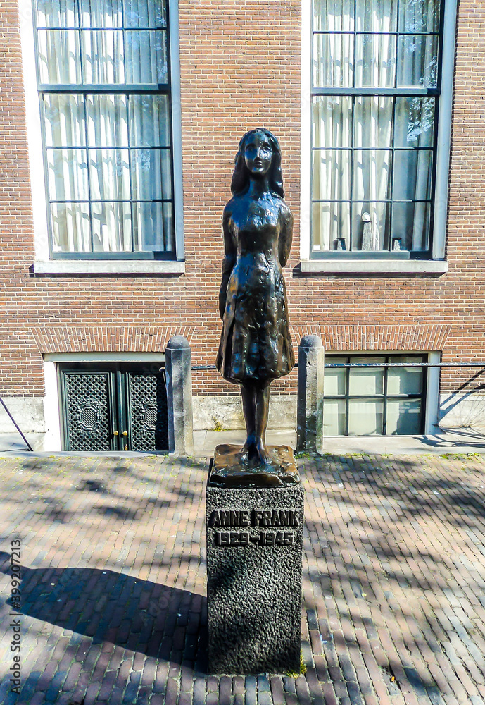 Anne Frank statue located on Westerkerk Plaza near the Anne Frank House