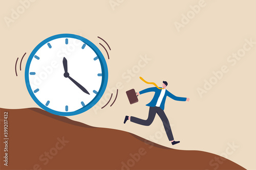 Run out of time, work deadline, time countdown or time management concept, tried businessman running away from falling rolling huge clock down hill.